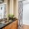 Model bathroom at our apartments for rent in Dallas, TX, featuring black countertops and a shower / bath combo.