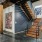 The stairway and halls at the Mitchell Lofts in Deep Ellum, Dallas, featuring brick walls and a painted mural.