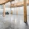 Common area and gallery space at our loft apartments in Dallas, TX, featuring industrial finishes and wood beams.