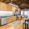 Model kitchen at our apartments for rent in Deep Ellum, featuring wood grain flooring and stainless steel appliances.
